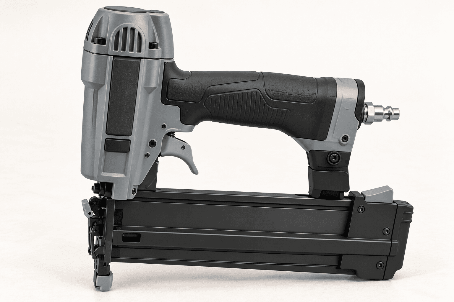 Original brand-neutral realistic three-quarter rendering of a complete 18-gauge pneumatic brad nailer with upright cylinder, straight magazine, contact nose and rear air fitting.